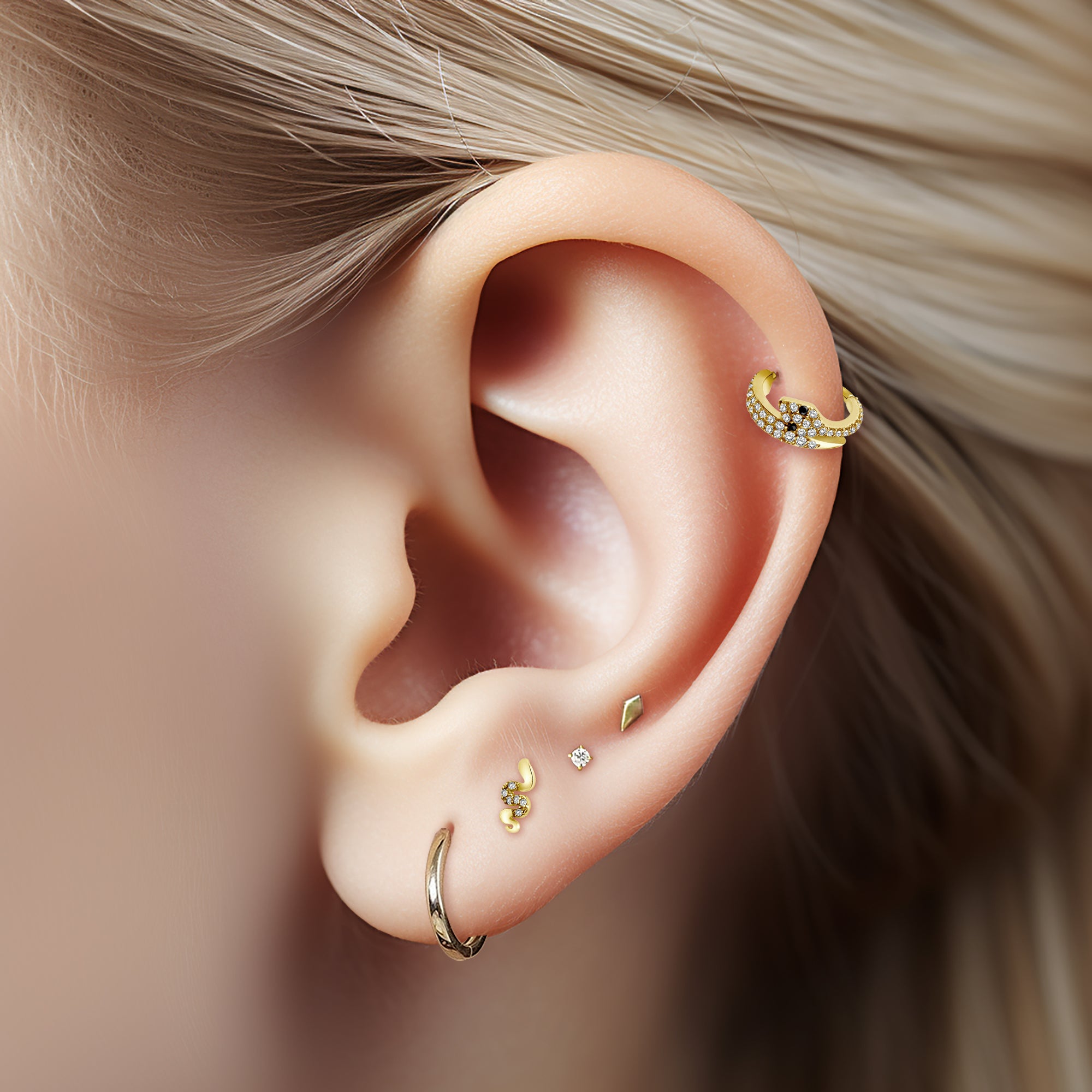 Silver ear stud with snake and gems