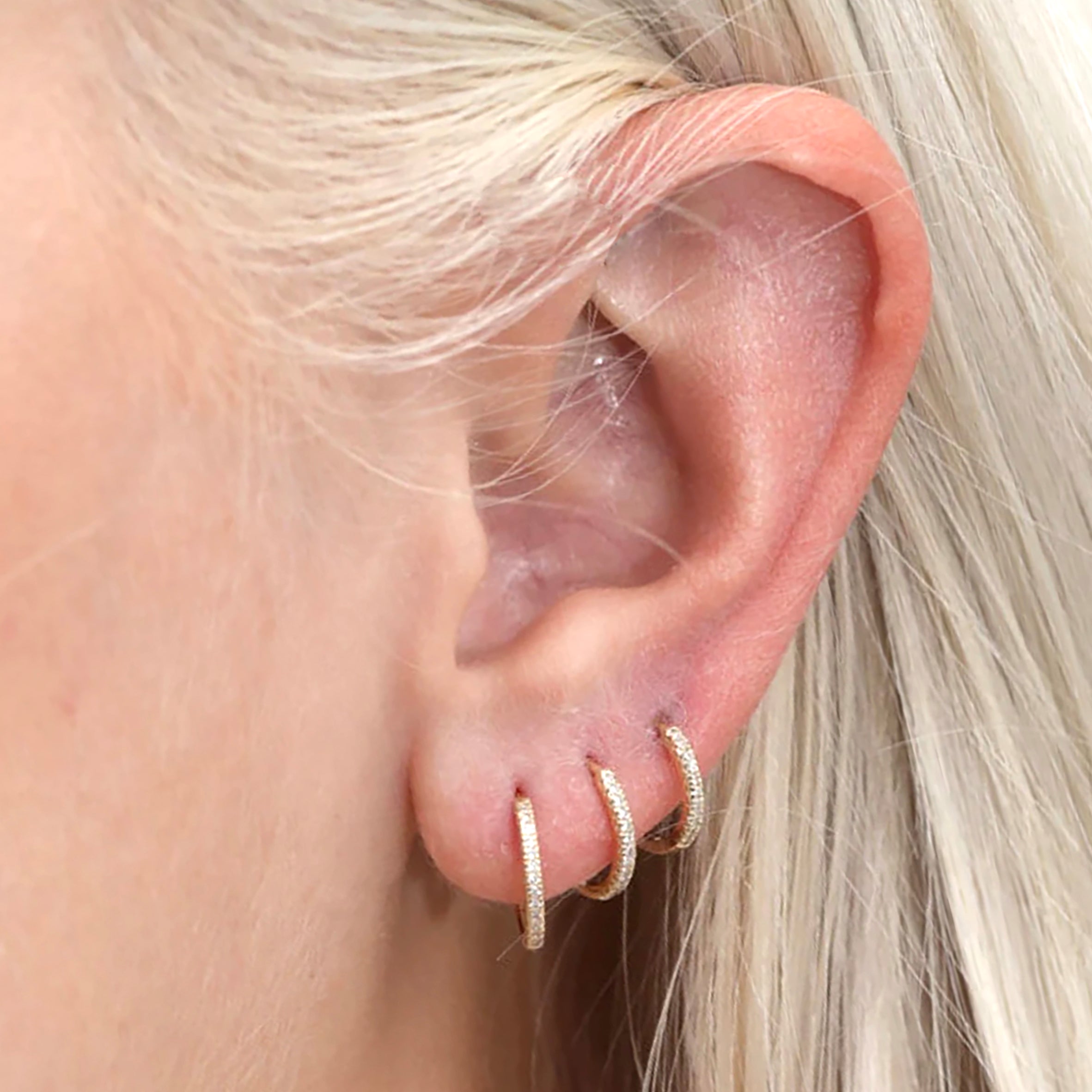 Huggie hoop earring with gems