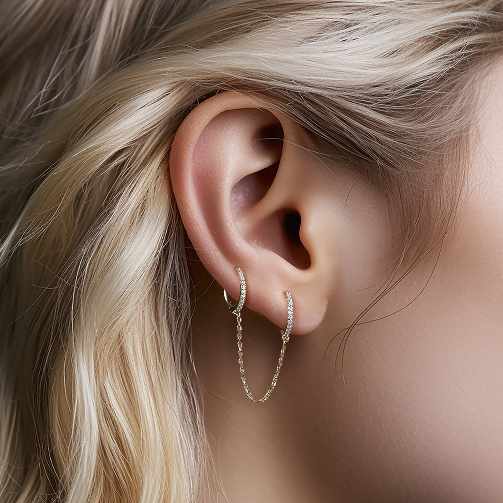 Two silver hoop earrings with multi-zircons and chain