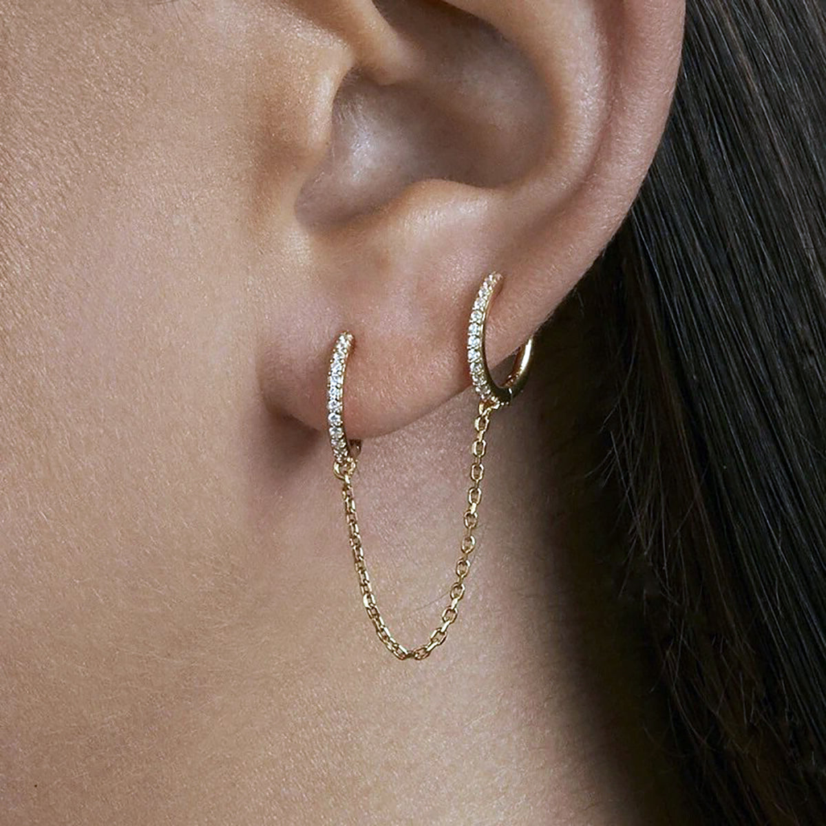 Two silver hoop earrings with multi-zircons and chain