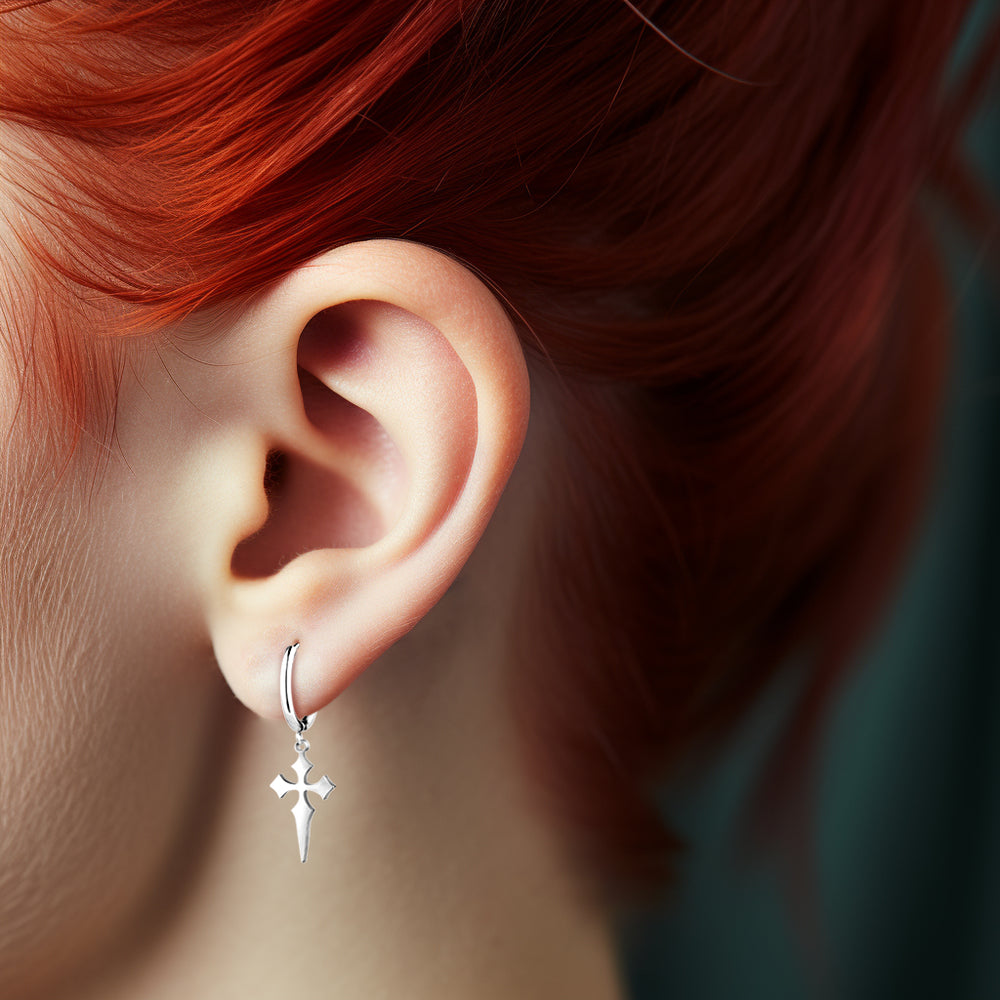 Steel hoop earring with dagger cross