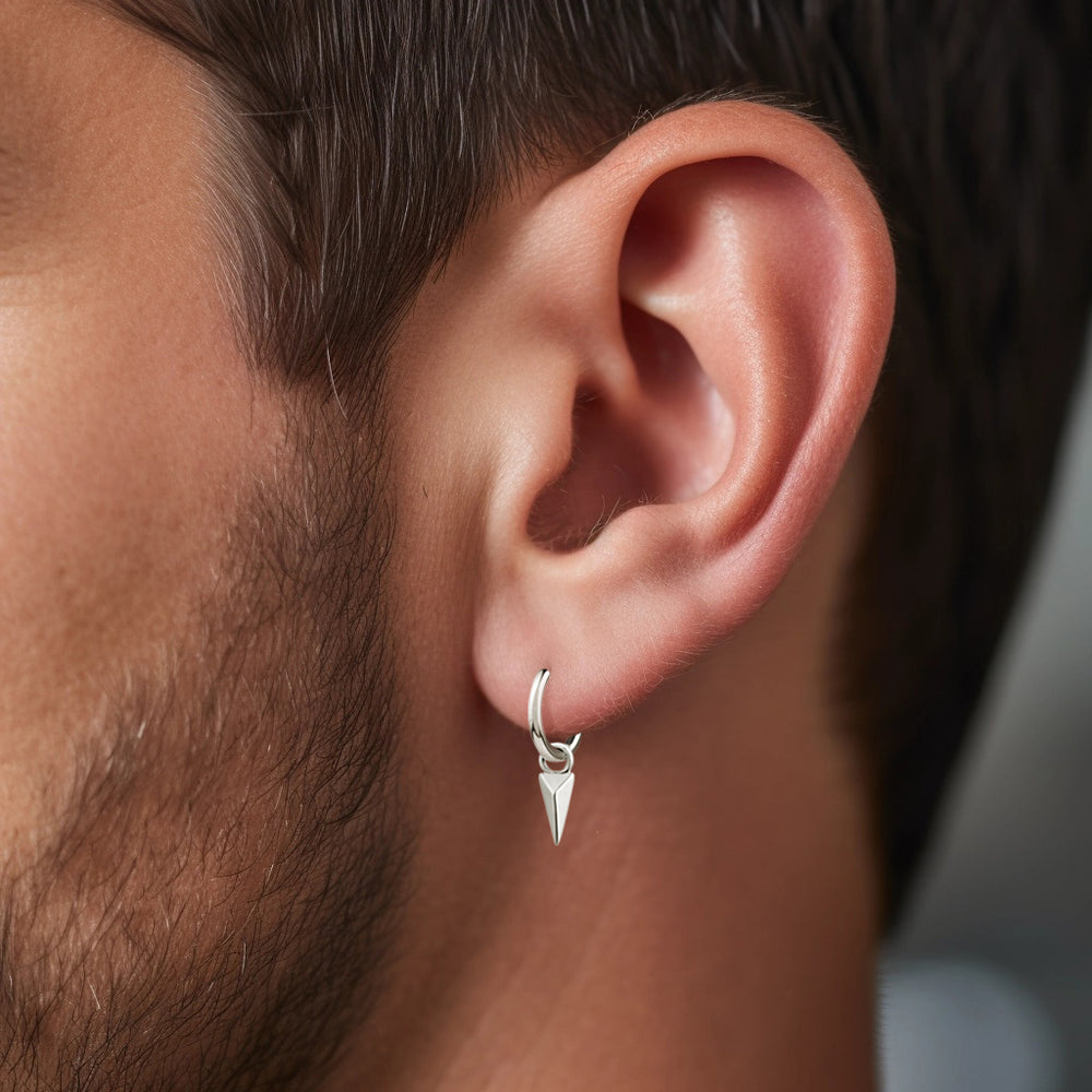 Steel hoop earrings with triangular spike