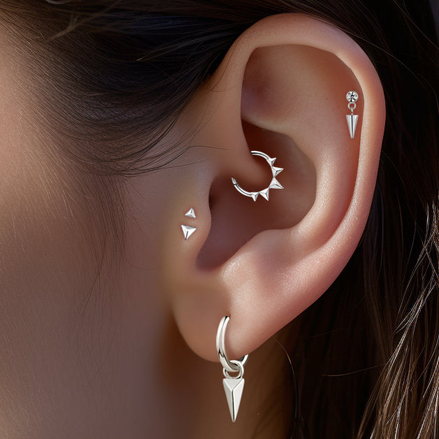 Steel hoop earrings with triangular spike