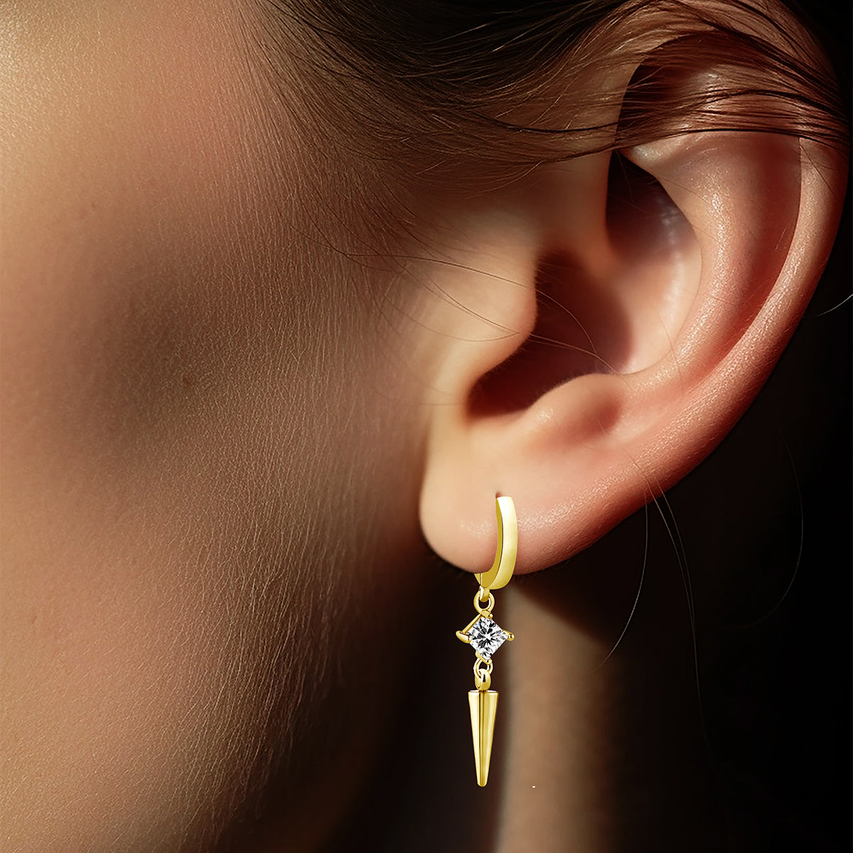 Golden huggie hoop earring with Glam Punk charm