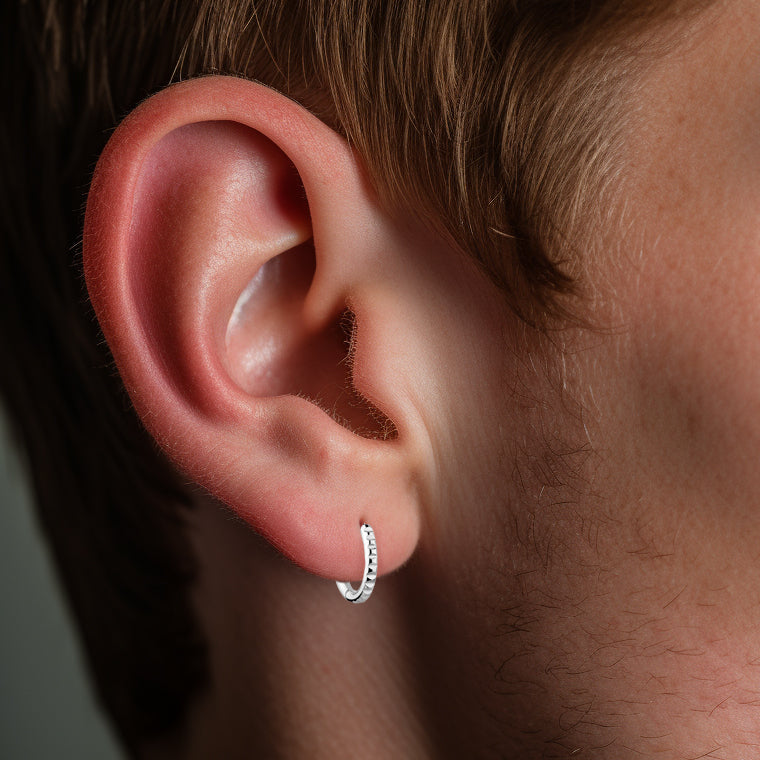 Steel hoop earring geometric texture
