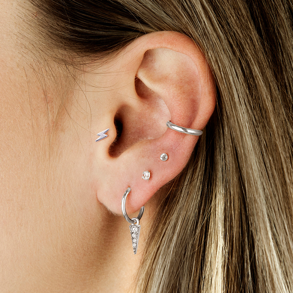 Surgical steel tragus with lightning