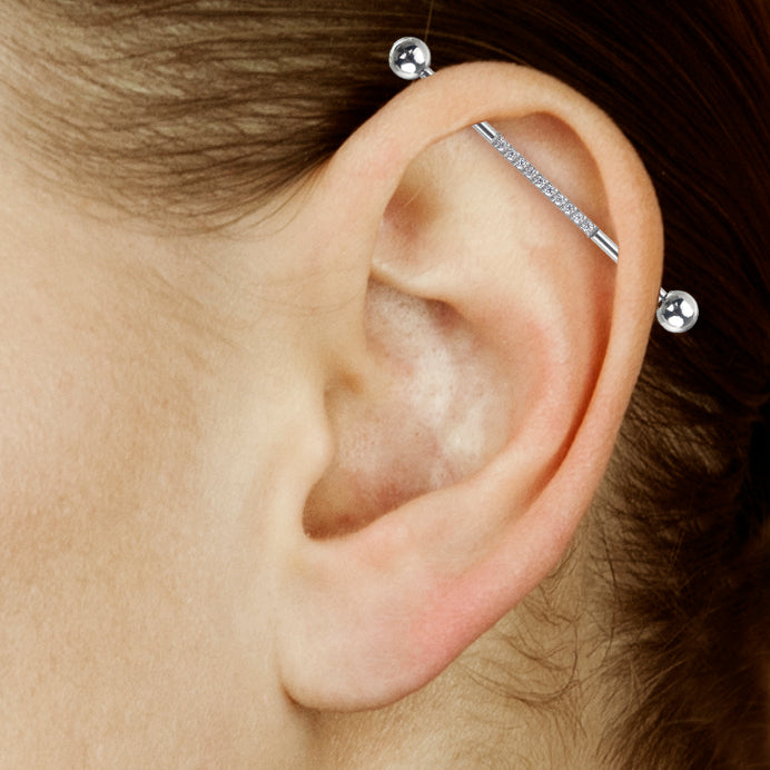 Surgical steel industrial piercing with gems