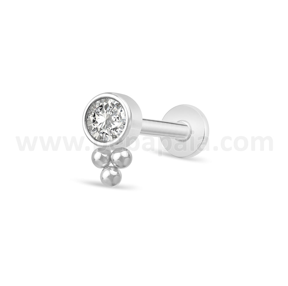 Bright piercing tragus and balls