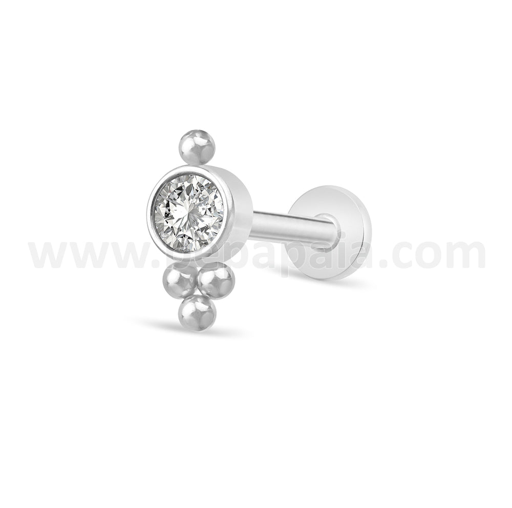 Bright piercing tragus and balls